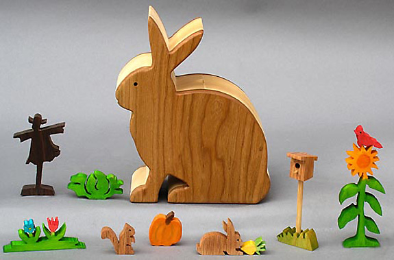 wooden garden animals in a rabbit box